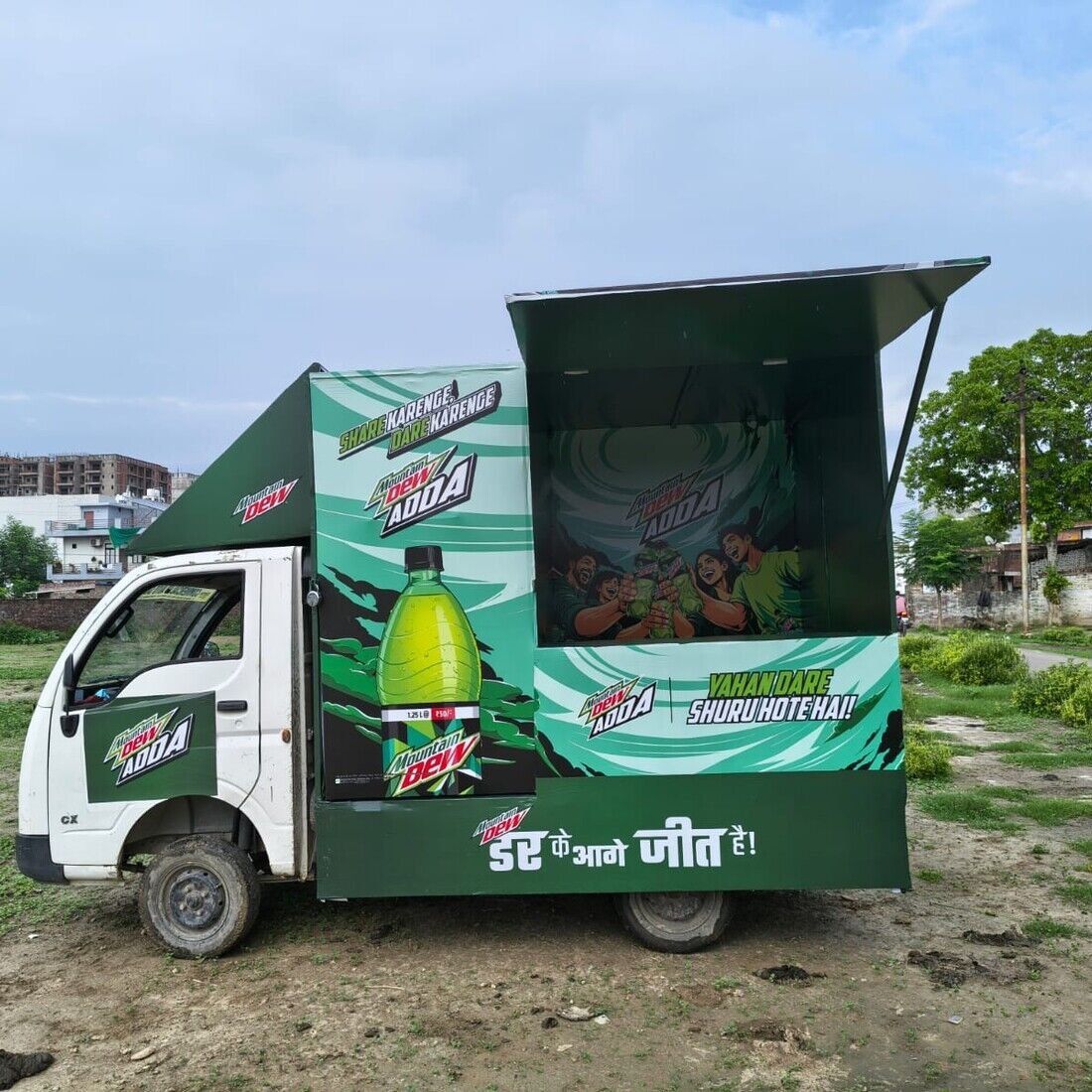 Fleet of Garnier Color Car branded promotional vans on-ground
