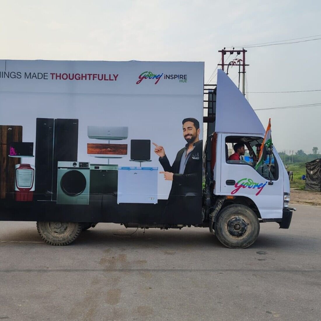 New Holland tractor branded van at a rural farming activation