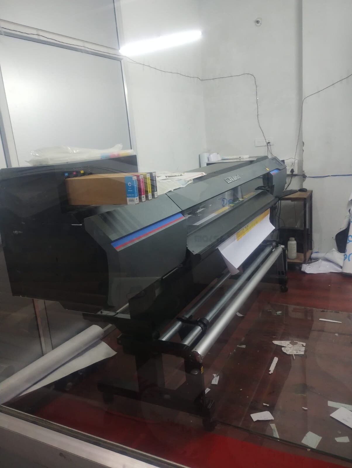 Roland large-format printer loaded with media at Rudra's in-house printing unit
