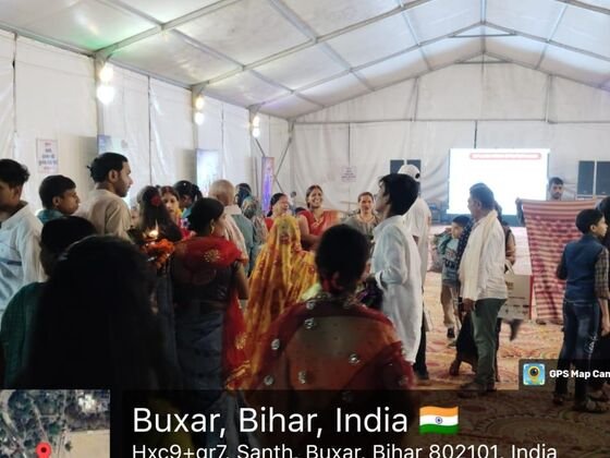 Crowd of visitors with lamps inside the Sun Neo activation tent